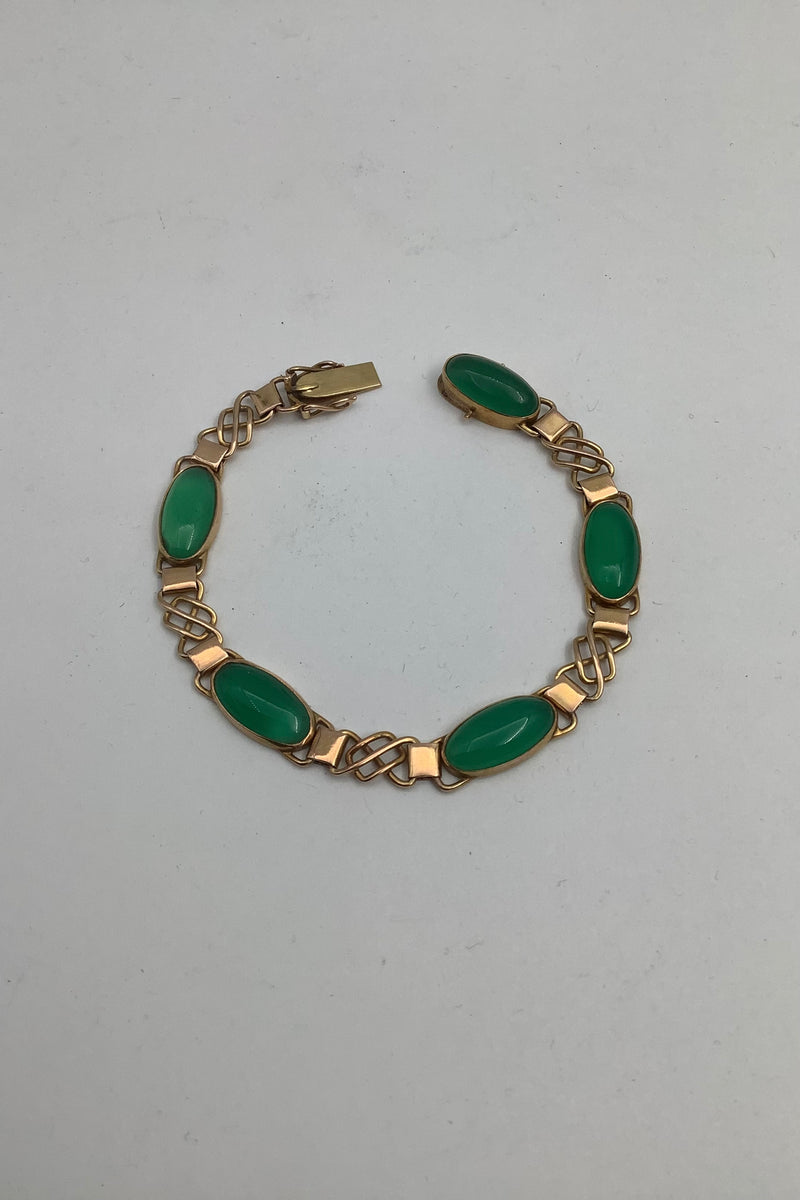 14 karat gold bracelet with green stones